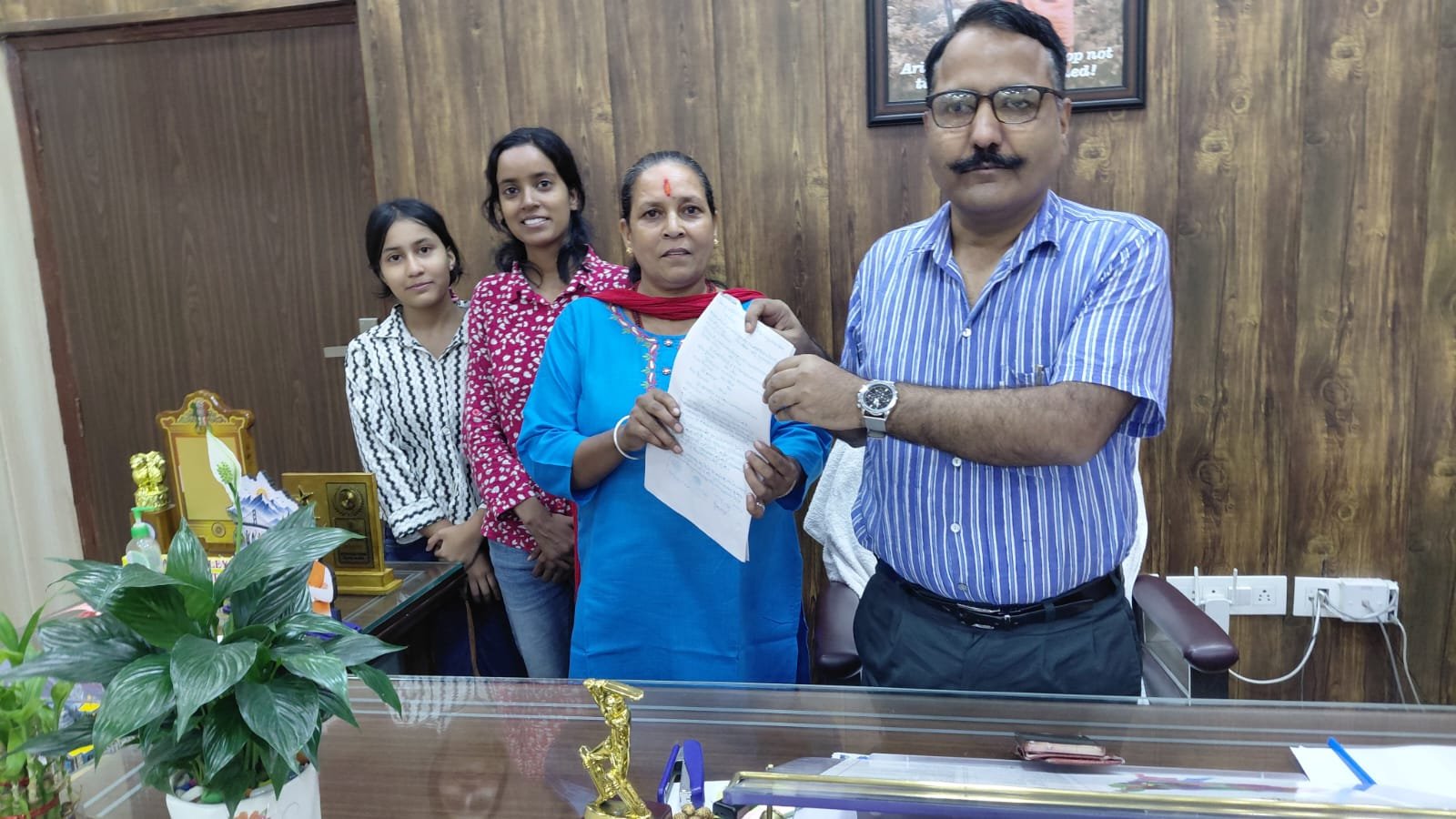 Nainital DM Office and Revenue Team Handing Over Land Possession to Bhagwati Devi in Dhari